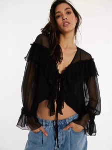 Elegant black sheer chiffon blouse featuring ruffled edges and front tie-up closure