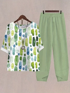 Detail of sage green pants with elastic waist and stylish tulip hem from a two-piece set