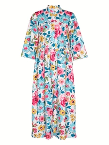Women's floral shirt dress featuring a vibrant multi-colored flower print and button-front design