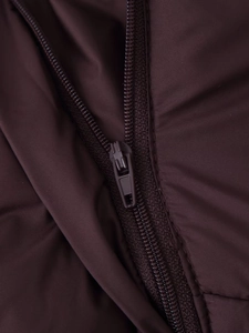 Detail of dark mahogany puffer jacket featuring a resin zipper and waterproof fabric