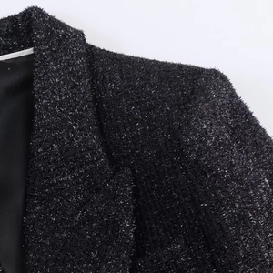 Detail of black tweed blazer with metallic silver threads and smooth inner lining