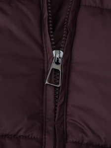 Detail of high-quality metal zipper on a dark purple quilted winter hooded puffer jacket