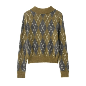 Detail of argyle pattern and ribbed hem on olive green knit polo sweater for women