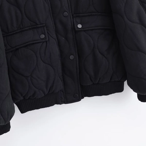 Women's black quilted cotton jacket with onion stitching, front snap buttons and pockets