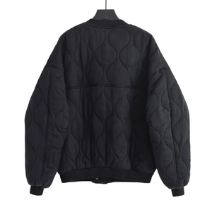 Women's black onion-quilted bomber jacket featuring a relaxed fit and ribbed cuffs