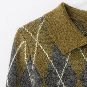 Detailed view of argyle knit pattern and ribbed polo collar on the wool sweater