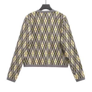Detailed back view of an argyle knit cardigan featuring grey and green diamond patterns