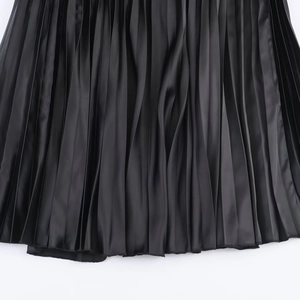 Elegant black pleated satin dress with long sleeves and slimming high waist detail