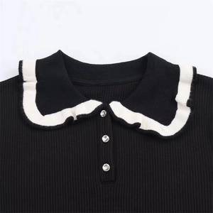 Slim fit black ribbed knit t-shirt with white contrast collar and rhinestone buttons