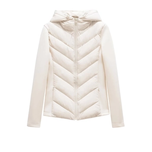 Detail of hooded quilted jacket featuring V-shaped stitching and contrast sleeve design