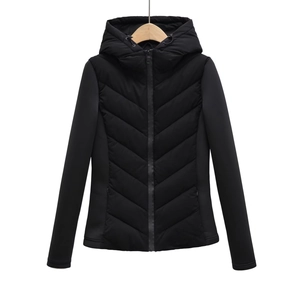 Detail of herringbone quilting pattern and contrast smooth sleeves on black puffer jacket