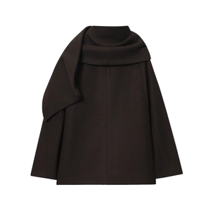 Detailed view of dark wool coat featuring a stylish scarf collar and textured fabric