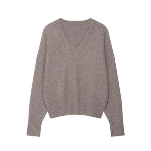 Detail view of mocha V-neck knitted sweater with ribbed cuffs and soft texture finish