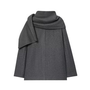 Detail of grey wool coat showing textured fabric and stylish scarf collar design