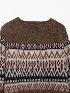 Close-up of vintage brown Fair Isle jacquard knit sweater with soft fluffy texture
