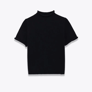 Detail of black short sleeve knit sweater showing mock neck and rolled edge finishes