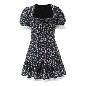 Detailed view of floral mini dress showing puff sleeves with white lace patchwork trim