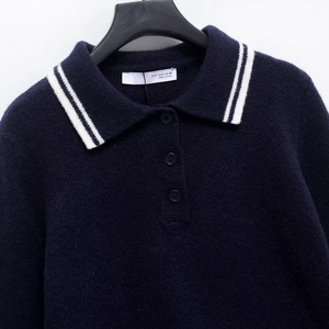 Navy blue plush polo sweater with white contrast collar and button detail