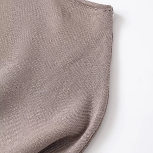 Minimalist brown long sleeve knitted sweater with ribbed cuffs and soft fabric texture