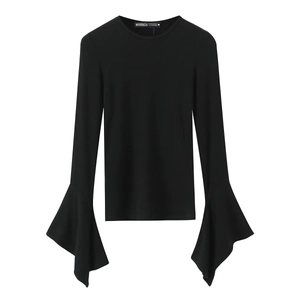 Close-up of the flared bell sleeves and ribbed knit texture of a black long sleeve tee