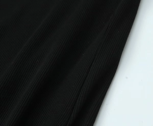 Close-up of the ribbed knit fabric texture on this black long sleeve women's t-shirt