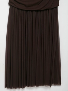 Detail of dark brown mesh pleated maxi dress showing layered ruffles and soft texture