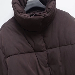 Women's dark brown puffer jacket with high collar and horizontal quilted design