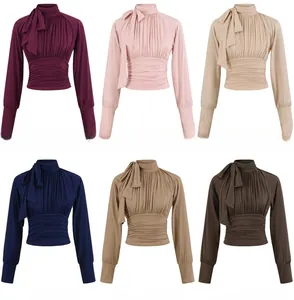 Six colors of long sleeve slim tops featuring bow tie neck and ruched chest detail