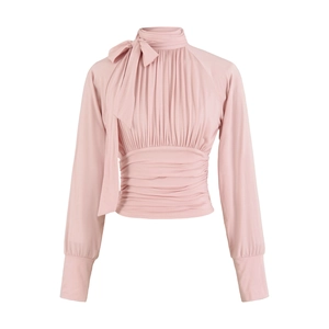 Detailed view of the pink high-neck blouse with elegant bow and pleated waist texture