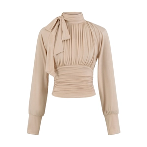 Detail of apricot blouse featuring pleated chest design and high neck bow tie accent