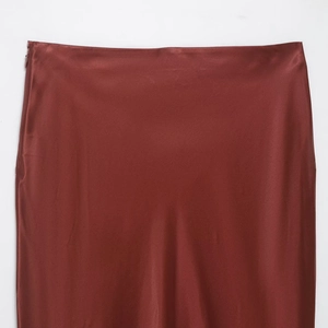 Elegant satin midi skirt in burgundy red featuring silky texture and side zipper
