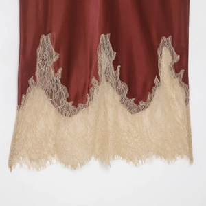 Elegant satin midi skirt in deep wine red featuring delicate gold lace hem detail