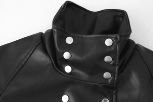 Close-up of black PU leather high collar jacket with double-breasted silver metal snaps
