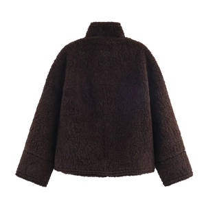 Macro shot of dark brown teddy fur texture on high neck plush jacket back view