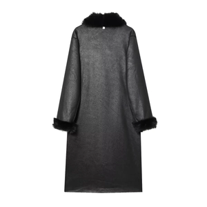Detailed close-up of the plush faux fur collar and smooth black leather texture on the coat