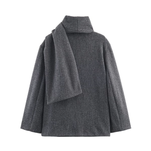 Detail view of dark grey wool coat featuring a unique scarf collar design and premium texture