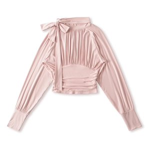 Close-up of pink long sleeve shirt with bow detail and vertical pleated texture