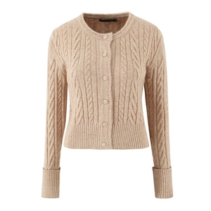 Detailed view of cable knit pattern and fabric buttons on a beige cardigan sweater