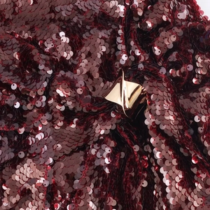 Elegant wine red sequin dress with a luxury gold geometric buckle and deep V-neck