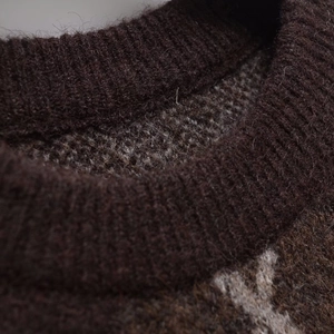 Deep brown diamond-knit round neck sweater with premium wool-blend texture and warm finish