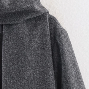 Deep grey wool blend coat with elegant scarf collar and thick textured fabric