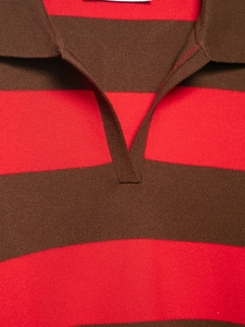 Close-up detail of knitted polo neck and classic red and brown striped texture