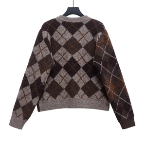 Detailed view of the diamond argyle pattern knit cardigan with classic ribbed cuffs