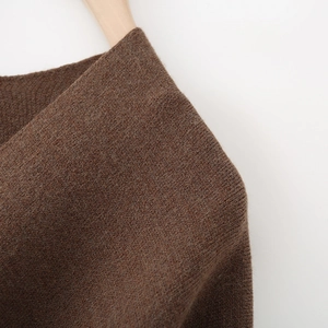 Women's dark brown long knit cardigan featuring a fine texture and shoulder detail