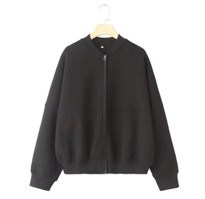 Close-up of black bomber jacket featuring ribbed collar and white size M neck label