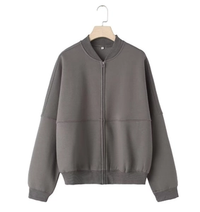Detail of dark grey zip-up bomber hoodie with ribbed cuffs and white size M neck label