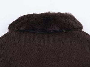 Close-up of brown knit sweater with premium faux fur collar and fine knit texture