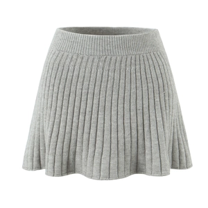 Detailed view of grey pleated knit mini skirt with elastic ribbed waistband texture