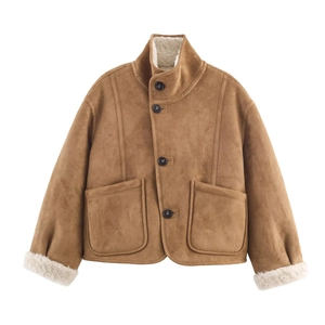 Close-up of brown faux suede jacket with white shearling lining and large pockets