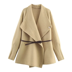 Detailed view of camel knitted cardigan with wide lapels and slim brown waist belt